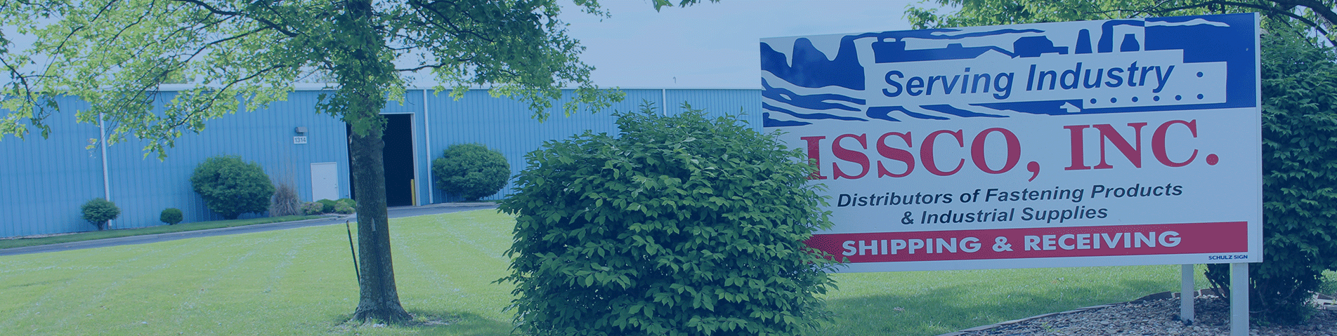 the ISSCO, Inc. sign in front of a warehouse